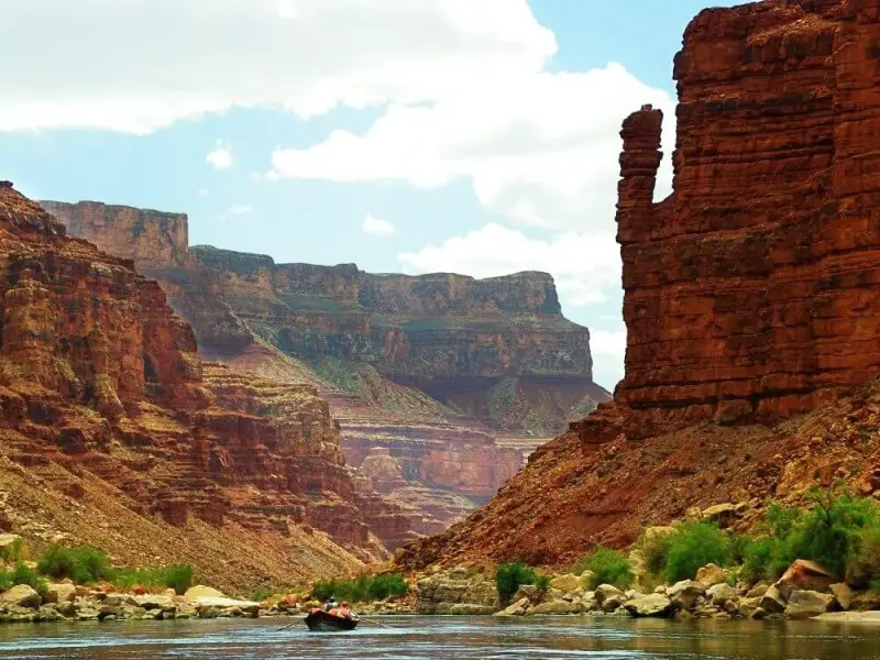 raft in grand canyon and pillar of stone on river rafting trip through grand canyon