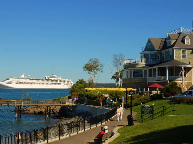 cruise ship with new england house in foreground in bar harbor