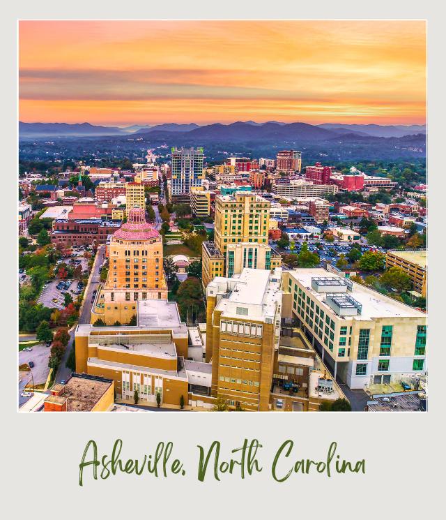 Buildings surrounded by trees and mountains in the background in Asheville North Carolina near Asheville Regional Airport