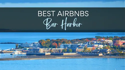 View of buildings surrounded by trees beside the ocean, with the text, Best Airbnbs Bar Harbor.