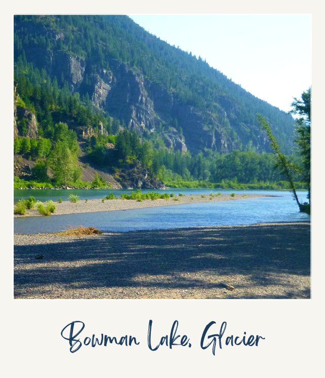 View of a lake and mountains surrounded by trees in the background in Bowman Lake, Glacier National Park.