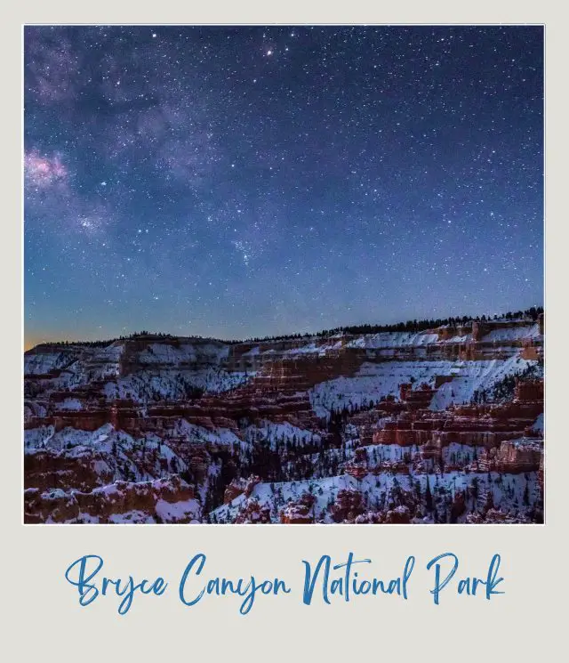 red sandstone columns covered with snow with milky way above in Bryce Canyon