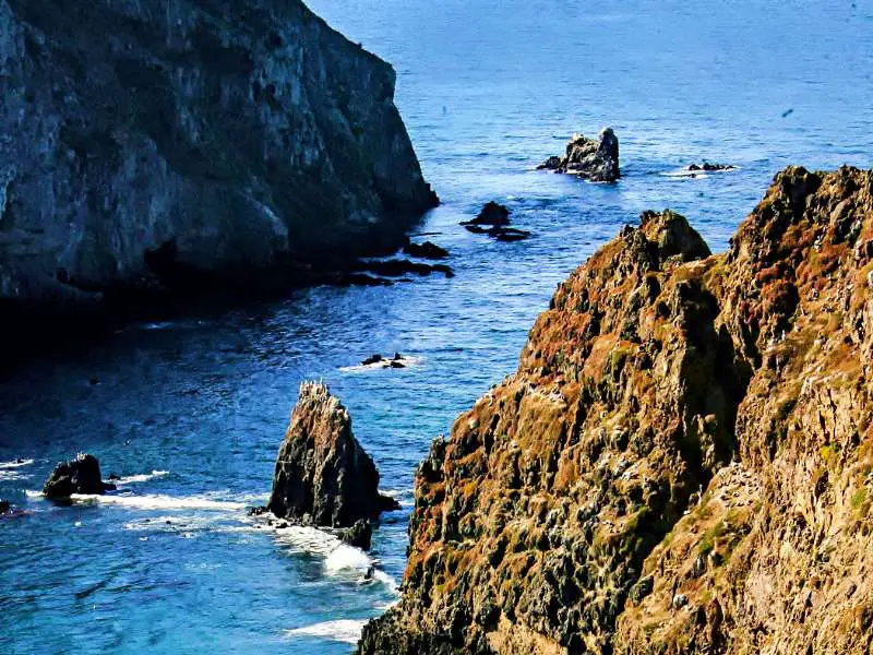 View of oceans surrounded by huge stones in Channel Islands National Park.