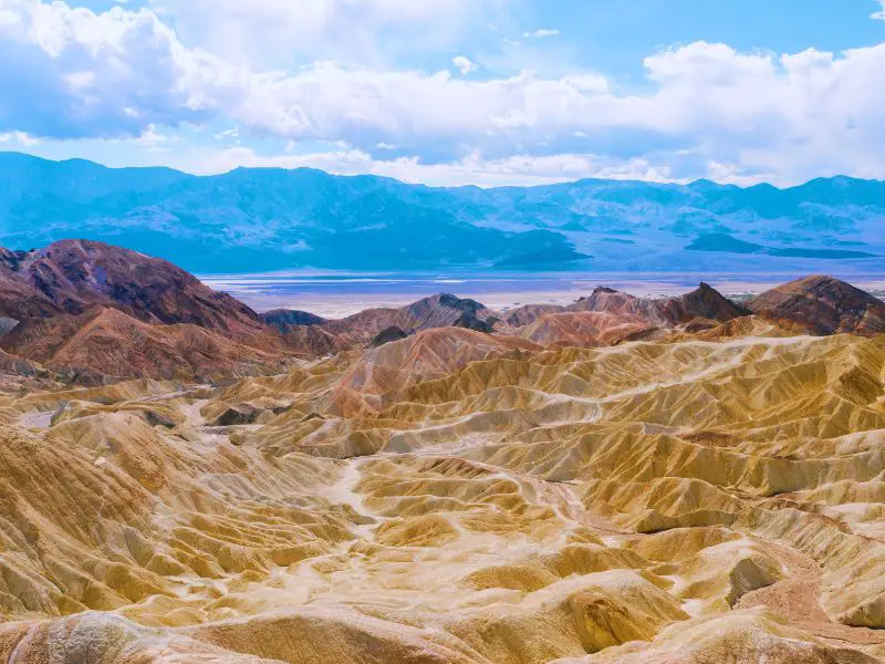 Mountain ranges under the blue sky in Death Valley National Park.