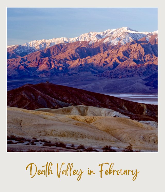 View of dunes and a mountain covered with snow in the background in Death Valley National Park.