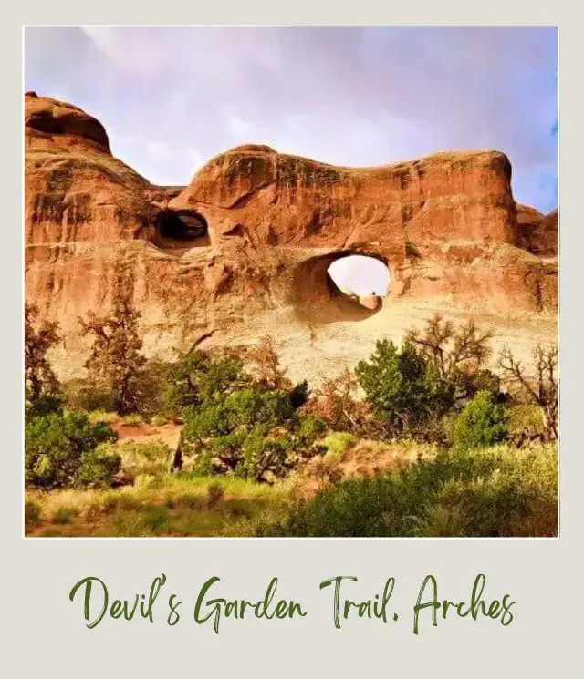 View of rock formations with a hole in the middle in Devils Garden Trail in Arches National Park.