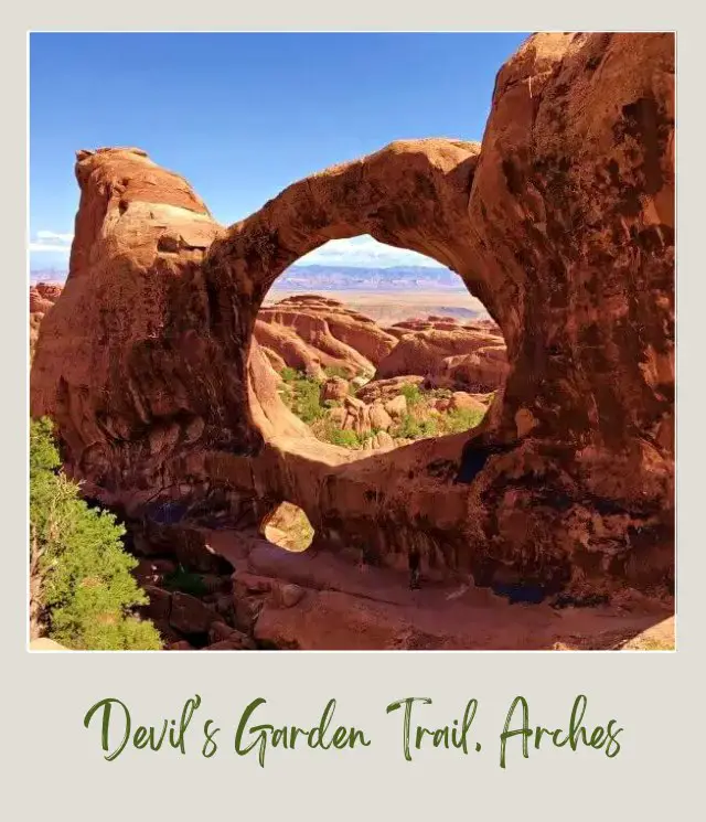 View of Double arch and behind are huge rock formations on Devils Garden Trail in Arches National Park.