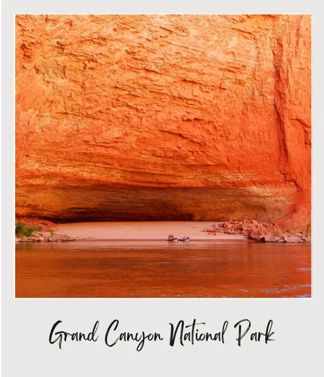 view of cavern in red wall at rovers edge on river trip through grand canyon