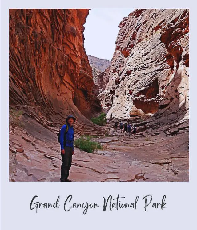 lone hiker sin side canyon from grand canyon on on river rafting trip through grand canyon