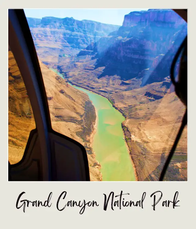 river insdie large canyon seen through screen of helicopter that took off from Grand Canyon National Park Airport