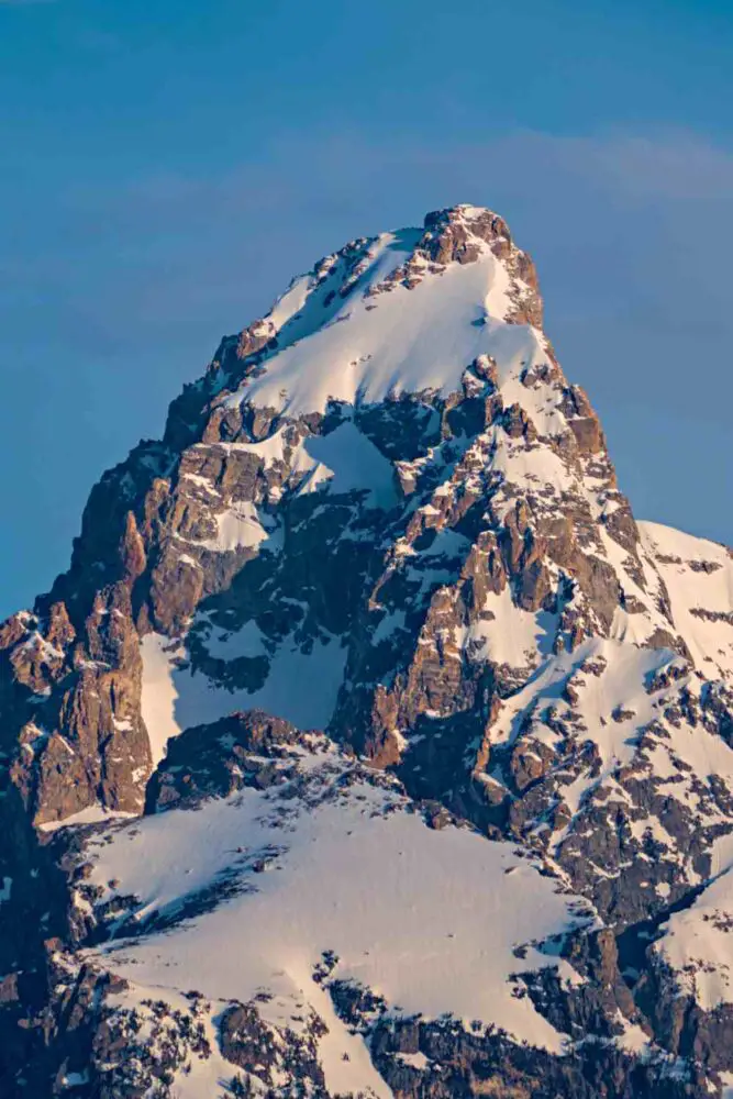 An image of the peak of snow-capped mountains