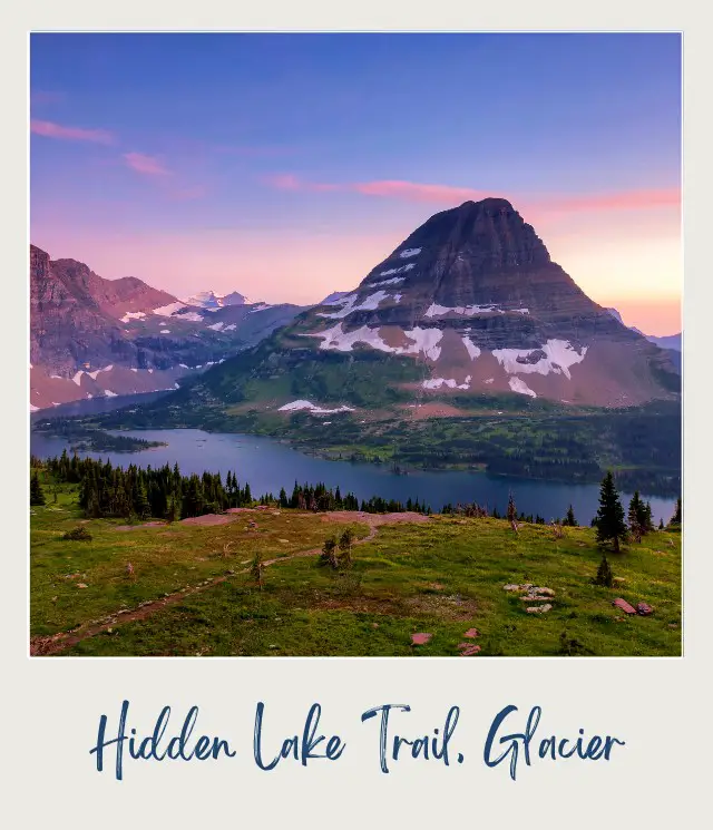 View of a lake surrounded by trees and a snow-capped mountain in the background during sunset in Hidden Lake, Glacier National Park.