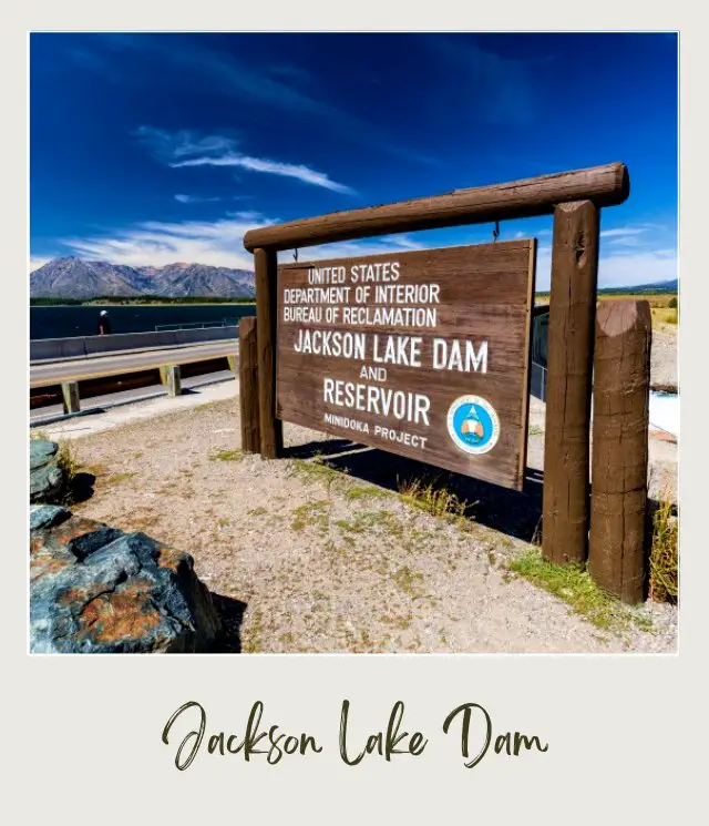 The wooden signage of Jackson Lake Dam and Reservoir in Grand Teton National Park.