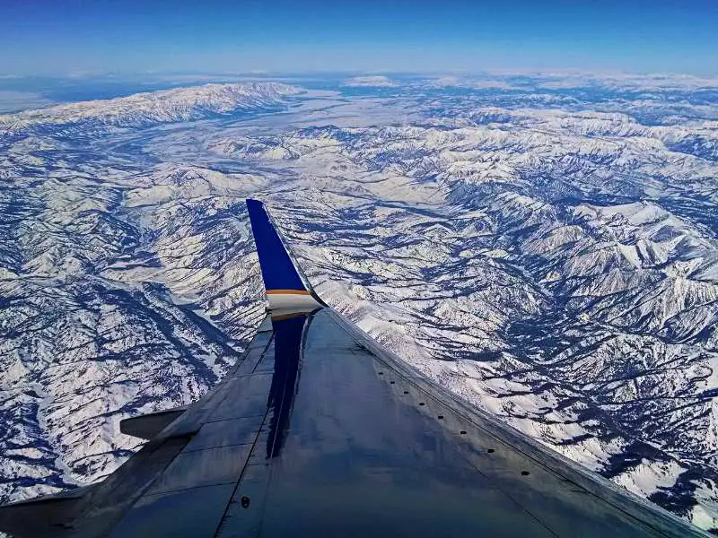 Aerial view of mountains seen through the window of the airplane near Yellowstone National Park
