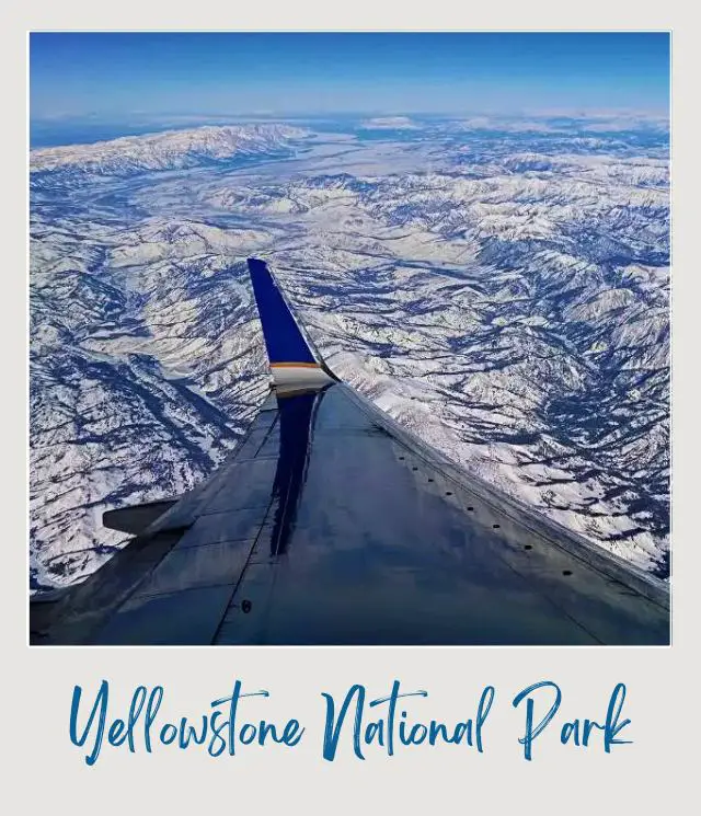 How To Get To Yellowstone National Park: Complete Guide Aerial view of mountains seen through the window of the airplane near Yellowstone National Park