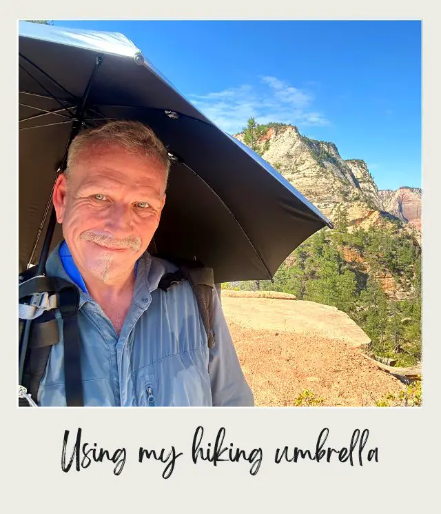 James Holding an Umbrella during his hiking at East Rim Trail to Observation Point Zion National Park