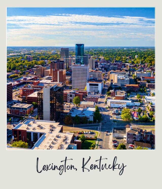 Roads in the middle of the city surrounded by buildings and trees in the daytime in Lexington, Kentucky, near Blue Grass Airport