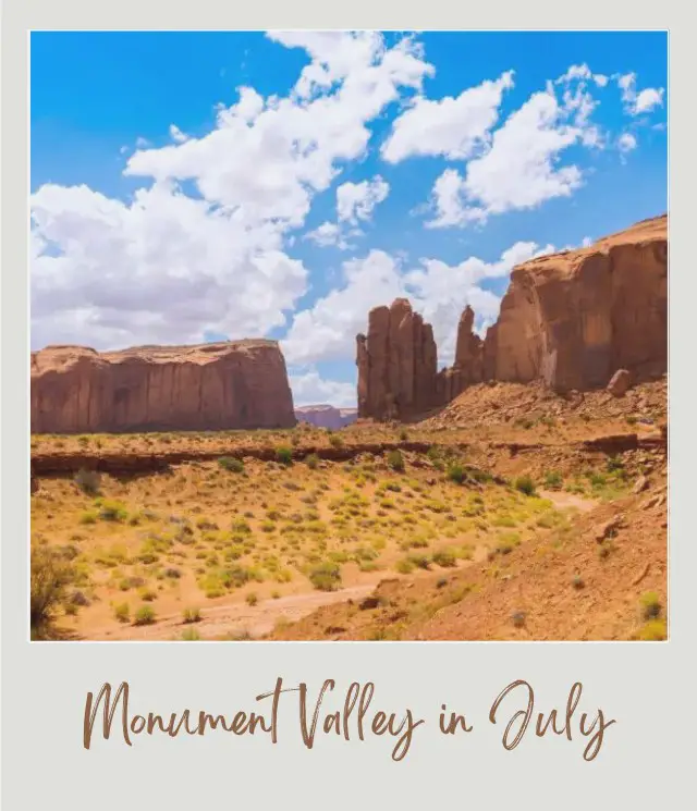 Visiting Monument Valley: What To Expect Throughout the Year View of rock mountains and a field of bushes under the blue sky in Monument Valley.