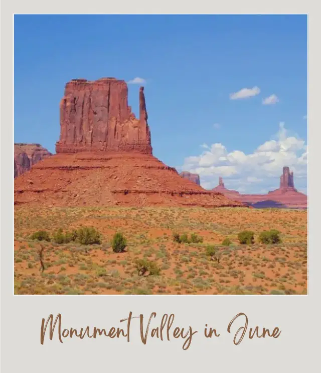 Visiting Monument Valley: What To Expect Throughout the Year View of rock mountains and a field of bushes under the blue sky in Monument Valley.