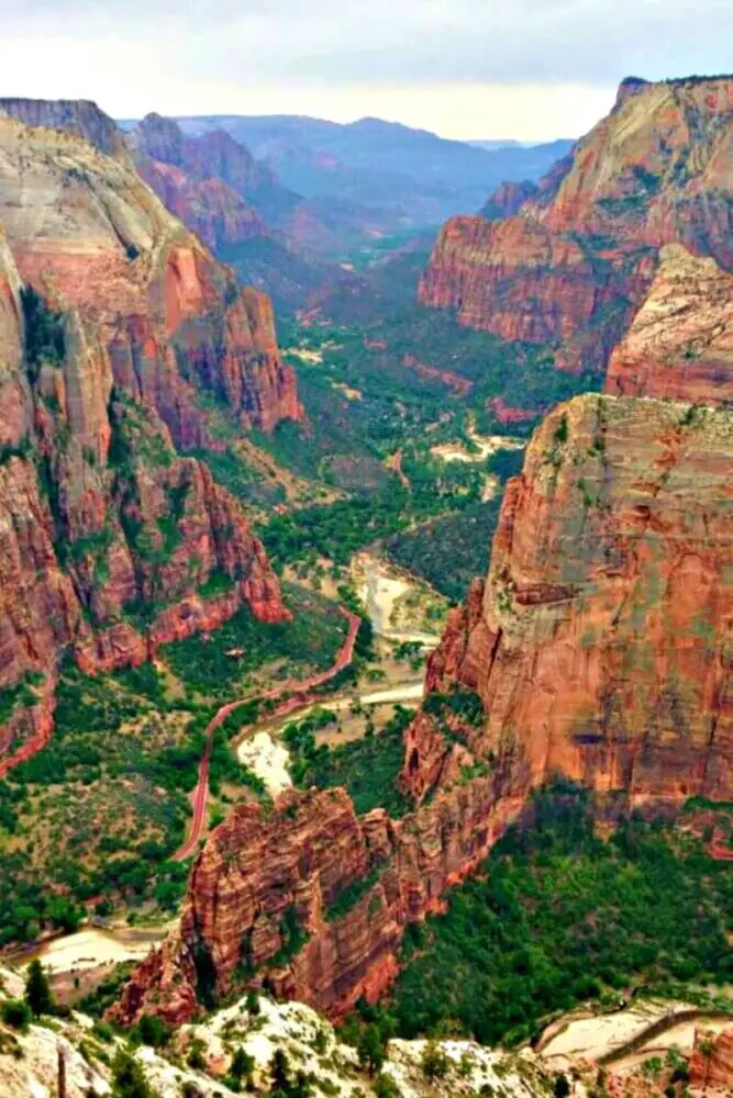 A sandstone formation with river and trees below it is called Observation Point Zion.