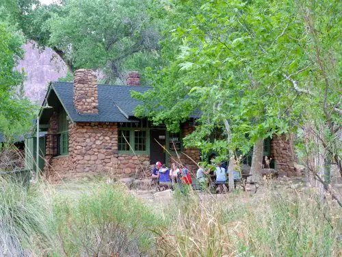 People sitting in front of Cabin in Phantom Ranch Grand Canyon