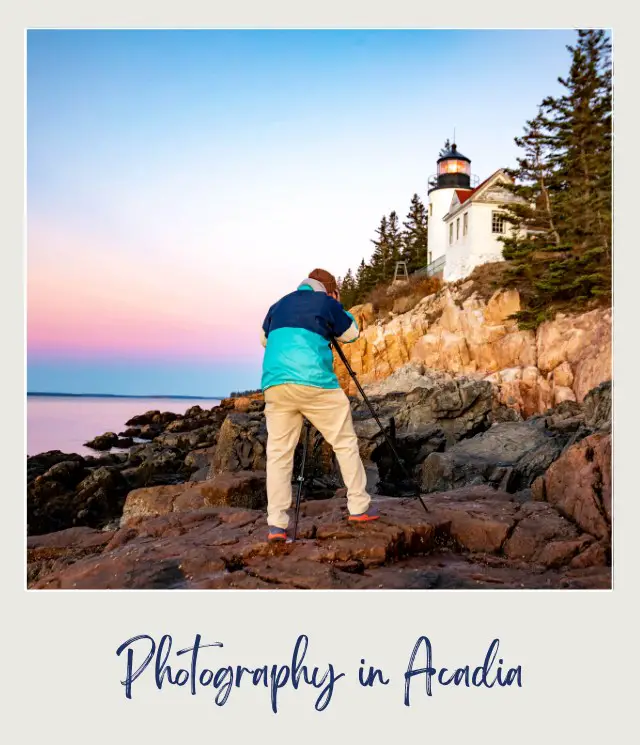 Man taking pictures of the lighthouse in the rocky place beside the ocean in Acadia National Park