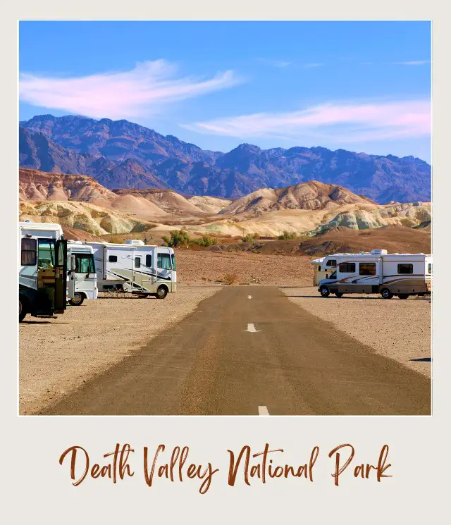 View of mountains and below are RVs parked beside the road in Death Valley National Park.