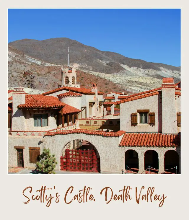 An image of a red-roofed castle surrounded by mountains in Death Valley National Park.