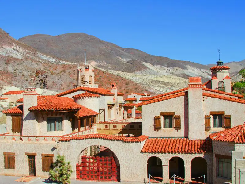 An image of a red-roofed castle surrounded by mountains in Death Valley National Park.