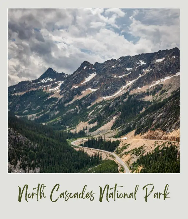 How To Get to North Cascades National Park: Complete Guide Aerial view of snow-capped mountains, trees, and road under cloudy sky in North Cascade National Park