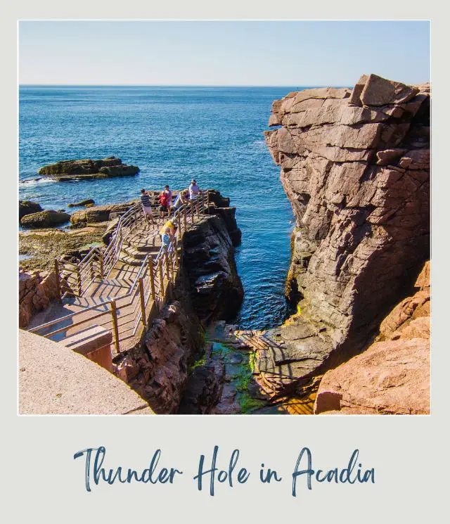 Stairs and rocky cliffs and people near the cliffs overlooking the blue oceans at Thunder Hole in Acadia National Park