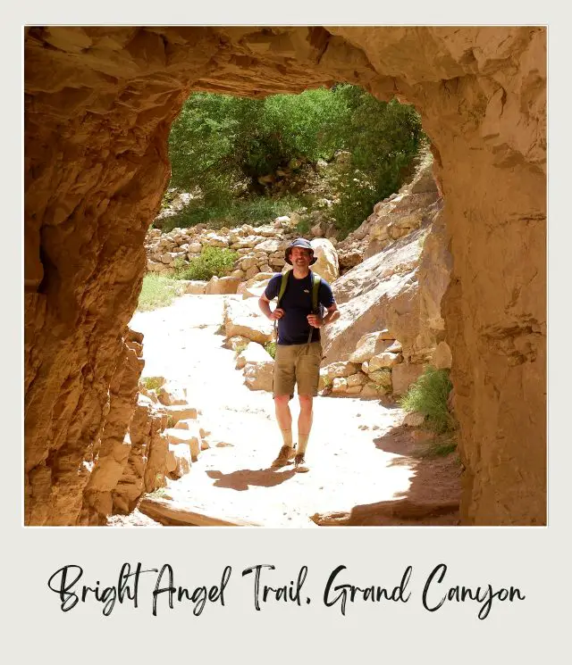 Kevin walking through a rock tunnel in Bright Angel Trail in Grand Canyon National Park.