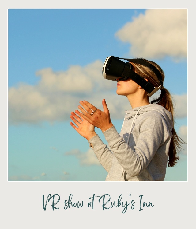 A girl in a hoddie jacket wearing a black device for Virtual reality in Bryce Canyon National Park