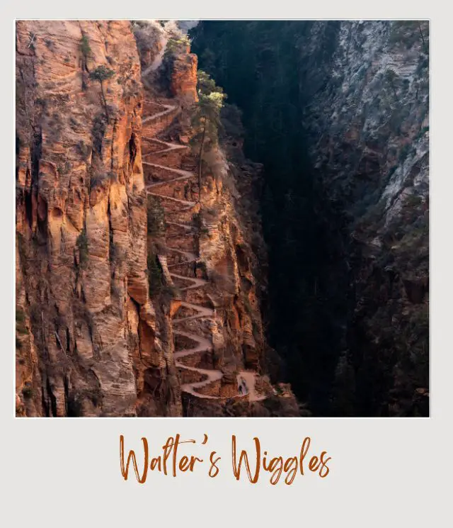 view from a drone of a steep cliff with a squiggle of switchbacks on angels landing trail in zion national park