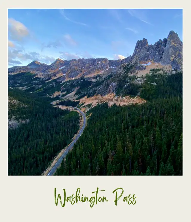 Aerial view of the road along the trees and mountains in North Cascades National Park.