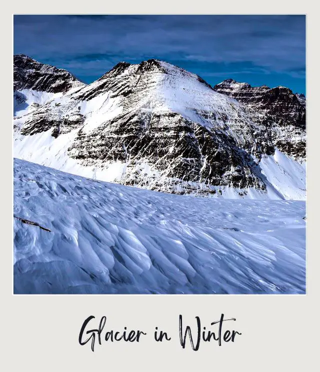 View of mountains covered with snow in Glacier National Park