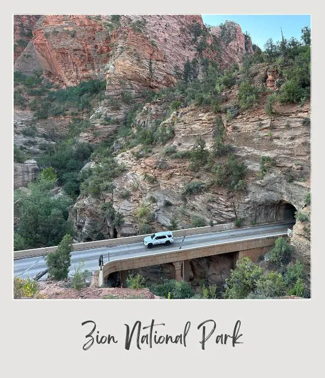 car in rod near tunnel in rocky cliffs near Canyon Overlook in Zion National Park