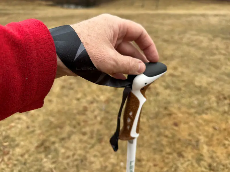 How to Use Trekking Poles: A Complete Guide for Hikers (With Pro Tips) closeup of hiking poles strap from below
