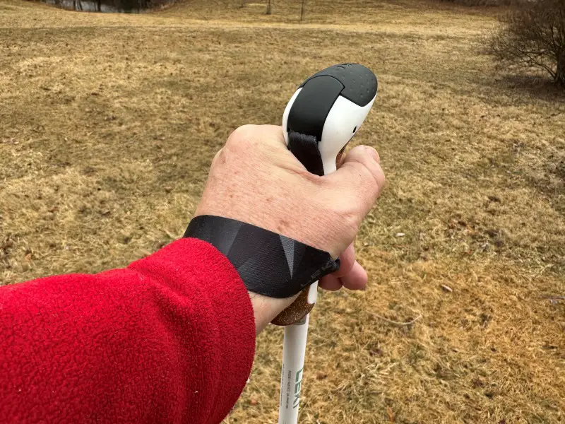 Pros and Cons of Trekking Poles: What You Need to Know closeup of hiking poles strap providing support